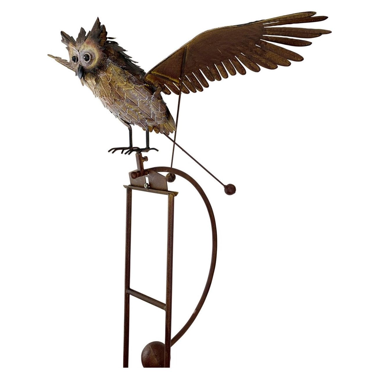 Side view of large rocker owl with wings open